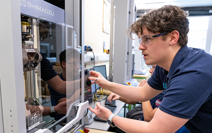 Student using tensile testing facilities