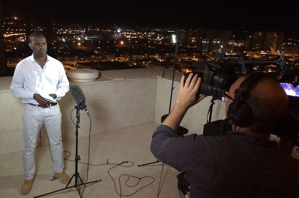 Clive Myrie reporting on camera