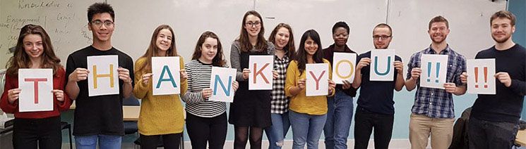 Student Callers holding letters that spell the message "thank you"