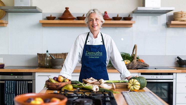 Chef standing in front of chopping board