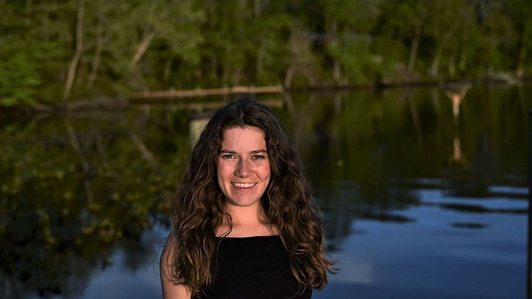 Emily Vooris by a lake