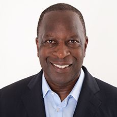 Headshot of Michael Fuller facing the camera wearing suit jacket and shirt