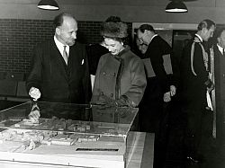 During a visit to open the campus library on 13 November 1964, Her Majesty talks with Basil Spence as he shows her a model of campus, which is still on display in Bramber House