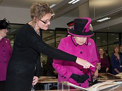 Dr Fiona Courage, Director of the Mass Observation Archive, shows Her Majesty the University's Special Collections archives