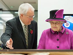 Chris Whittick, Senior Archivist at East Sussex County Council, shows Her Majesty items from The Keep's archives