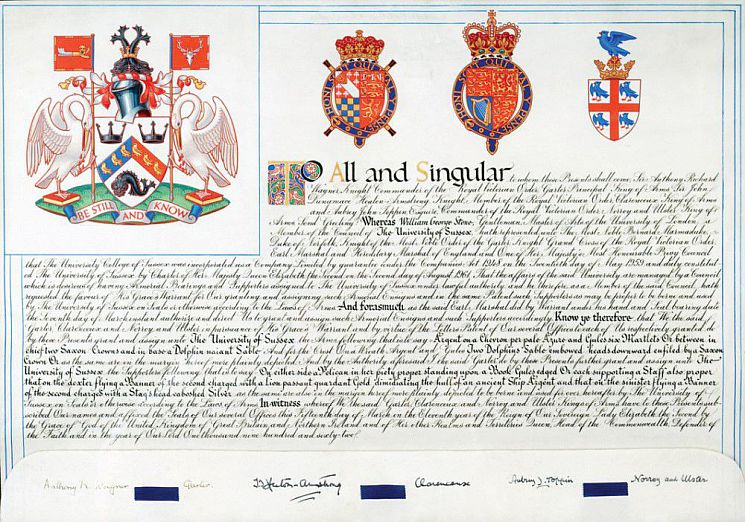The document that represents the royal charter of the University of Sussex, showing the Sussex coat of arms, royal seals and a full sheet of words written in traditional caligraphic script