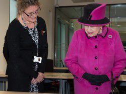 Dr Fiona Courage shows Her Majesty more of the University's Special Collections archives