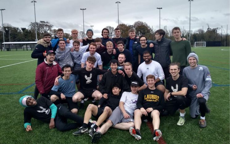 Alumnus Adam Simmonds and friends on a sports pitch