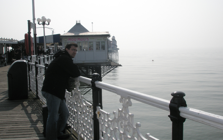 Gavriil Papadopoulos looking over the balcony on Brighton's Palace Pier