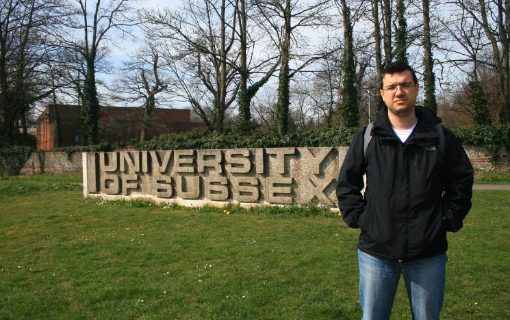 Gavriil stood in front of the University of Sussex sign on campus when returning for a visit in 2011