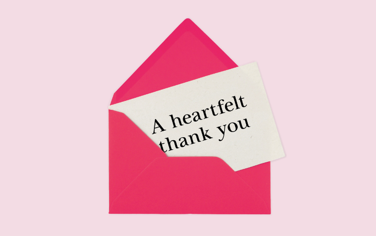 An illustration of an open envelope with a letter peaking out that has the words 'A heartfelt thank you' on it.