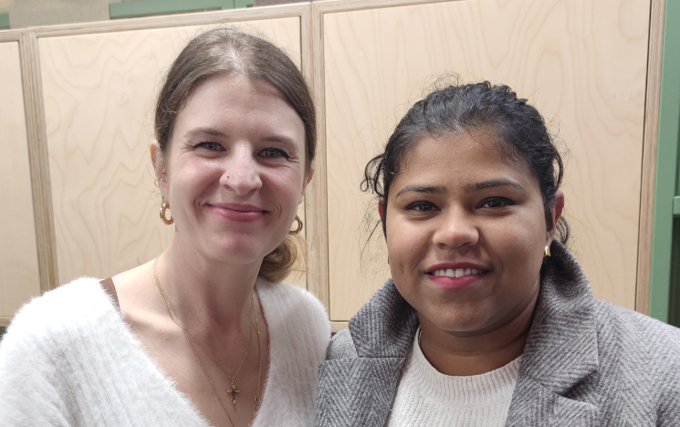 Azahara Corrales (left) and Tumpa Das (right) smiling as they pose together.