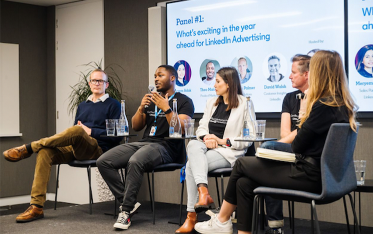 Theo Maloney speaking to the audience at a LinkedIn panel event.