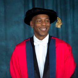 Topher Campbell receiving his honorary doctorate from the University of Sussex
