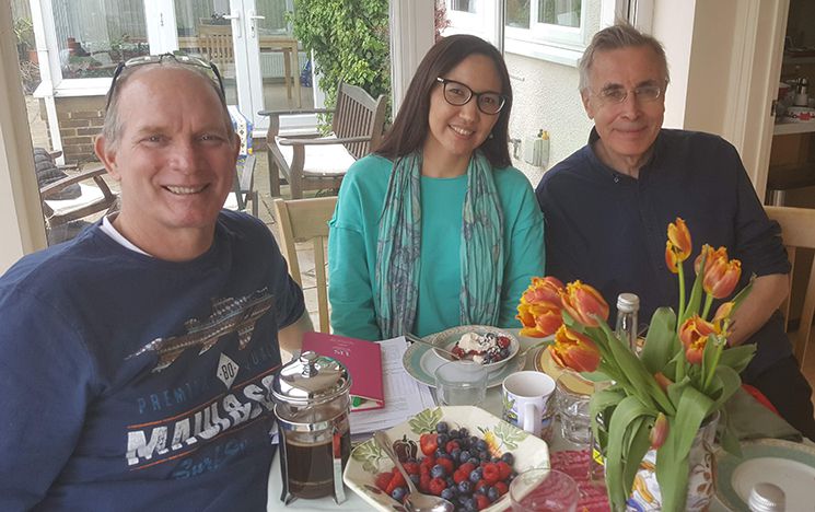 Aigerim Mussabalinova and her PhD supervisors Craig Lind and Prof Richard Vogler seated at a table