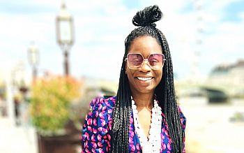 SO tile for April Frimpong Sussex alumna Nadia Bob-Thomas outdoors, smiling