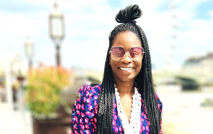 Nadia Bob-Thomas outdoors, smiling.