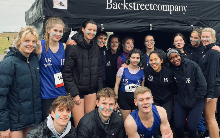 Olly Watts with members of the BackstreetCompany team and University of Sussex student athletes.