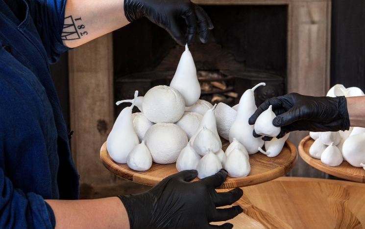 Scenterpiece – a monochrome ceramic still-life made in collaboration with artist Justine Hounam. The installation is scented with three different fragrances, each fruit portraying a different dish.