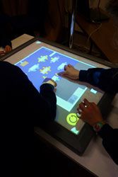 Children using a digital touch tabletop