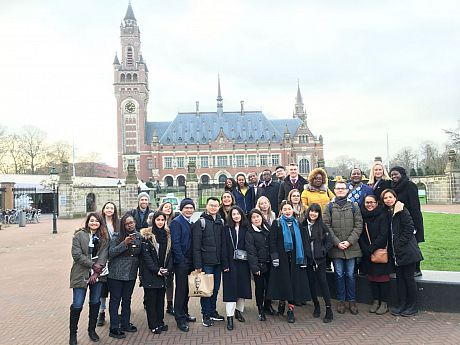 Group of students posing outside International Court of Justice building