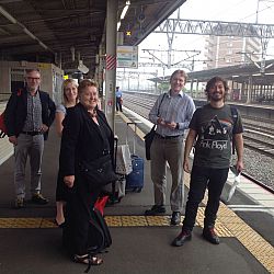Cheer members with Dr Simon Thompson waiting for train to Kyoto