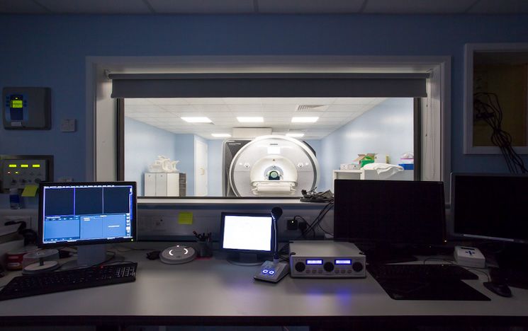 View of MRI scanner through the window of the operation room