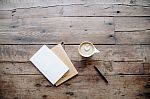 books and coffee on a wooden table