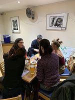 people at a table playing board games