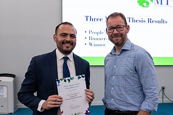 Jorge Ortiz Moreno receiving the Second Place Award for the 2022 3MT. Award given by Professor Jeremy Niven.