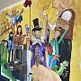 Image of a mural of characters from Roald Dahl books, The BFG, Willy Wonka, James and the Giant Peach, around a metal water fountain.