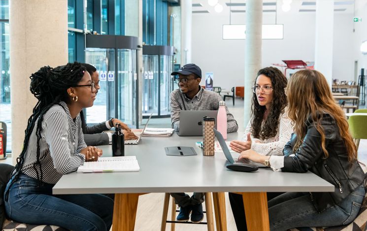 people sitting around a table talking