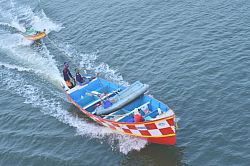 A small boat approaches the fishing harbour near Anchuthengu village