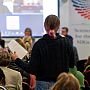 Person in audience posing question to the panel at the Q&A part of our first SSRP Week session 'Good COP/Bad COP'