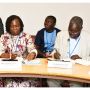 moderator Mrs Vida Duti (left) and speaker Mr Alfred Okot Okidi (right) sitting next to each other pictured in the UN conference room during the High-Level Political Forum side event