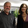 SSRP member Martin Spinelli and IDS Director Melissa Leach smiling into the camera while standing in the exhibition space during the opening event