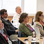 Seated audience attentively listening to a keynote speech on "Equitable Partnerships for Sustainability Research"