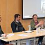 Zoomed in photo of our "Equitable Partnerships" panel featuring SSRP researchers and their project partners from abroad. The Chair Prof Robin Banerjee can be seen facilitating the session, while three of the panelists are seated to the right of Robin and the remaining two online panelists are pictured via a big screen