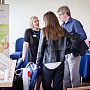 Dr Helen Prance discussing Engineering students final year posters displayed at the Meeting House