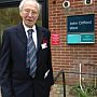 Professor John Clifford West, inaugural Dean of the School, outside the building named in his honour JCW