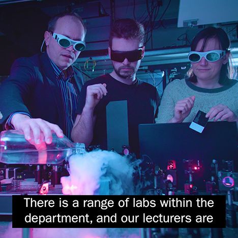 A video still showing scientists at work with two lines of subtitle