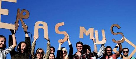 Students holding up cardboard letters spelling 'Erasmus'