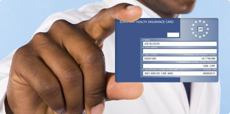 Someone holding a European Health Insurance Card