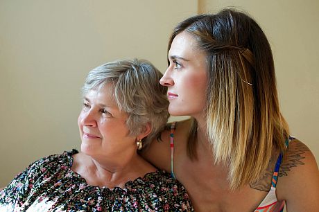 A photo of a mother and a daughter embracing