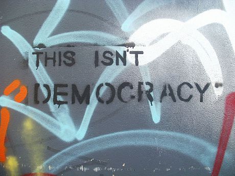 Graffiti reading 'this isnt democracy'