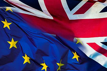 A hybrid photo showing the UK flag melting into the EU flag