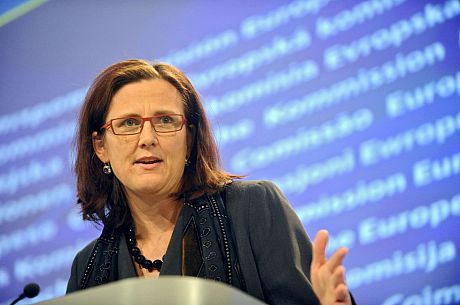 A photo of Cecilia Malmström, speaking from a podium