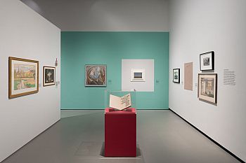 View of a gallery displaying artworks