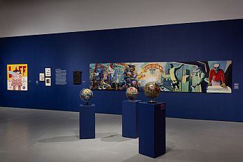 View of a gallery displaying artworks