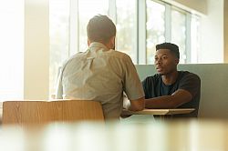 Two people in a meeting